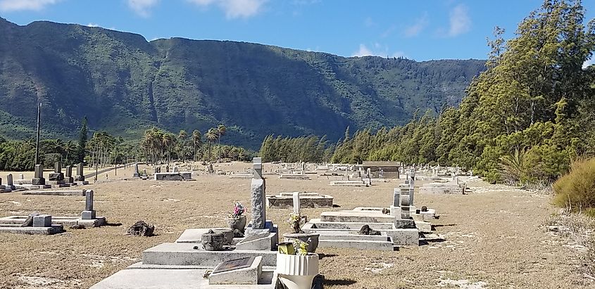 One of many cemeteries on the peninsula. There are thousands of former patients buried here. Two of the best known caregivers to die here are Father Damien and Mother Marianne Cope