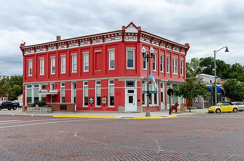 The original Farmers State Bank building in Lindsborg, Kansas, USA, now houses City Hall and features a vibrant red exterior.