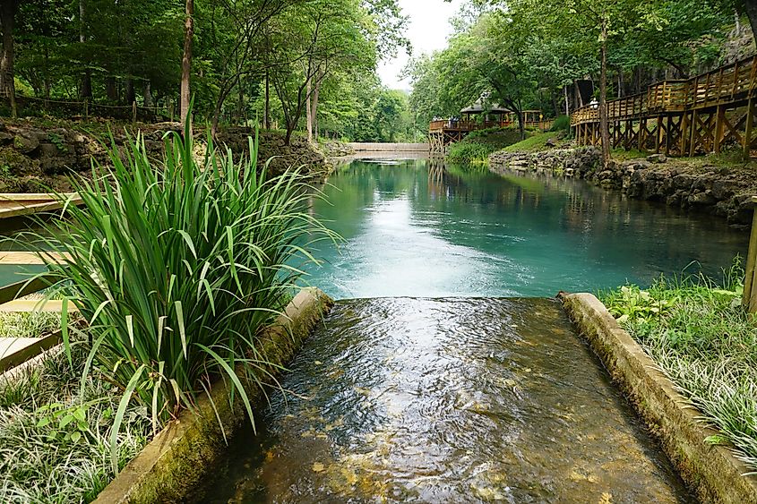 Beautiful landscape and blue water of a natural spring near Blue Spring Heritage Center, Eureka Springs, Arkansas, U.S.A