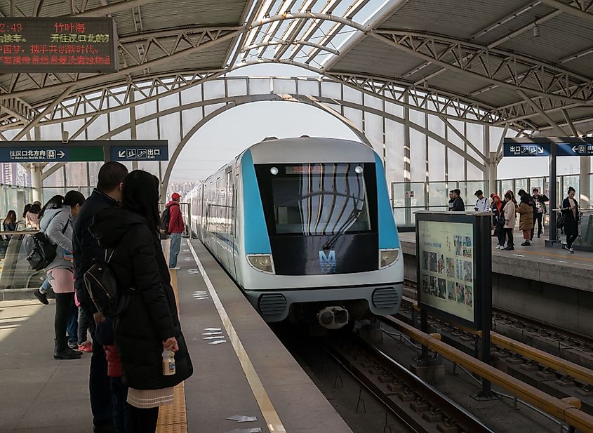 Chinese people waiting for the metro on aerial line 1 in Wuhan, Hubei, China. 