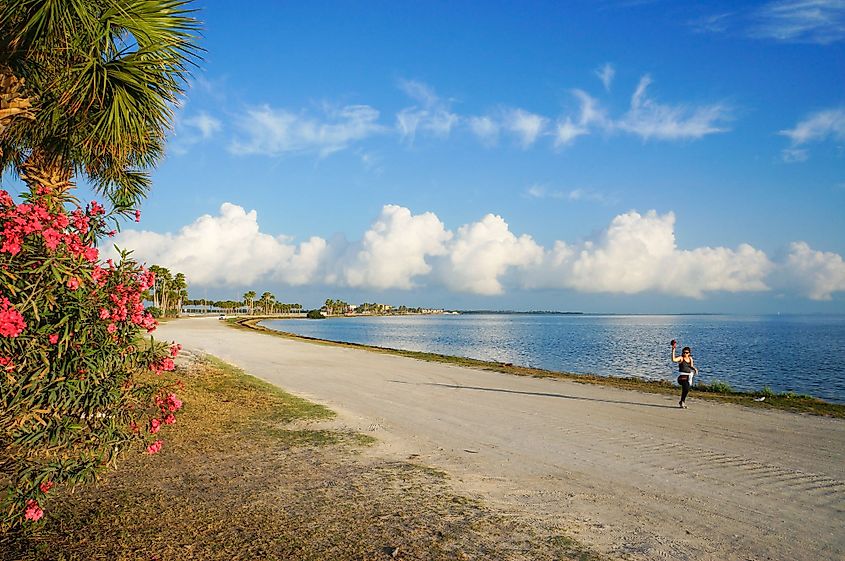 A woman jogging in the morning at Dunedin Causeway, Dunedin, Florida.