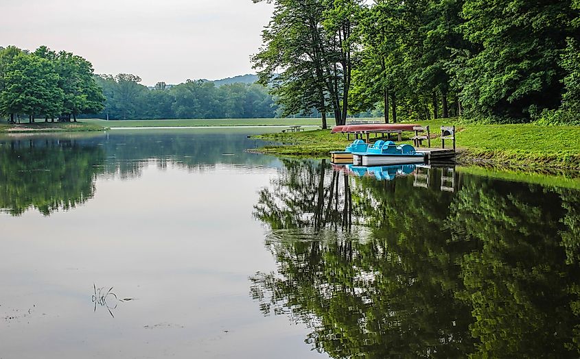 Paddleboats and canoes line the shore of the lake at Scioto State Park in Chillicothe, Ohio