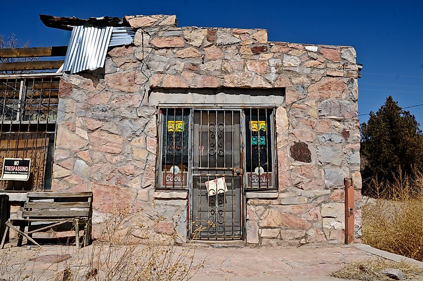 Cuchillo Bar in Cuchillo, New Mexico, a rustic adobe-style building with a weathered facade and wooden porch