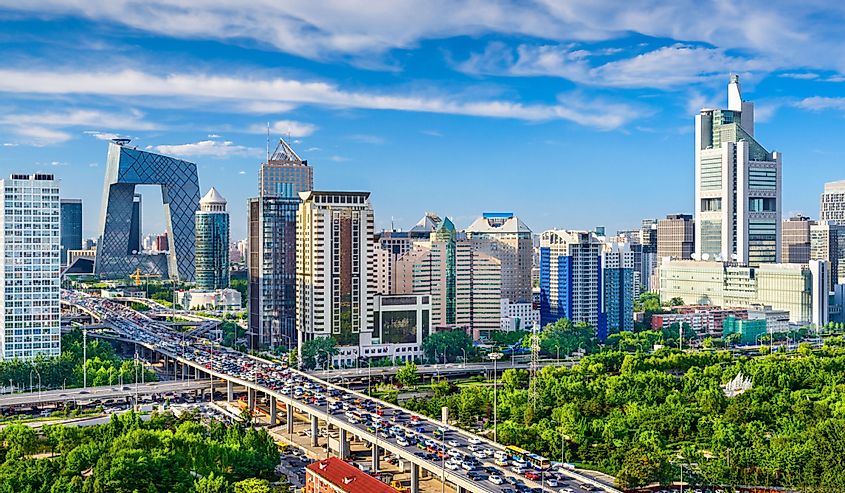 Beijing, China cityscape with heavy traffic and green trees