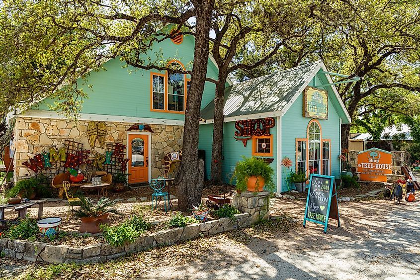Colorful shop with artwork on display in the small Texas Hill Country town of Wimberley, via Fotoluminate LLC / Shutterstock.com