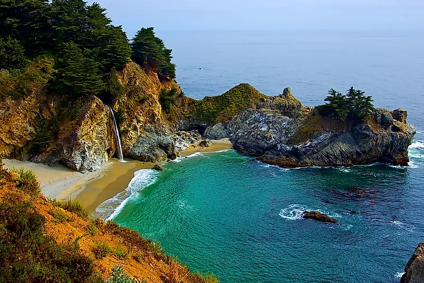 McWay Falls dropping to the beach along the Big Sur coast, Julia Pfeiffer Burns State Park.