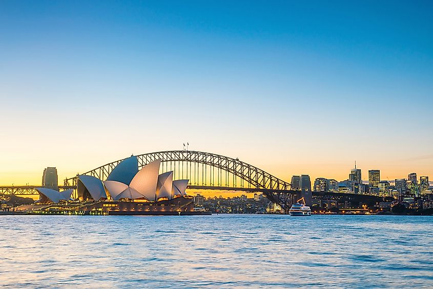 The Sydney Opera House at Bennelong Point in Sydney Harbour, showing the white sail-shaped concrete shells.