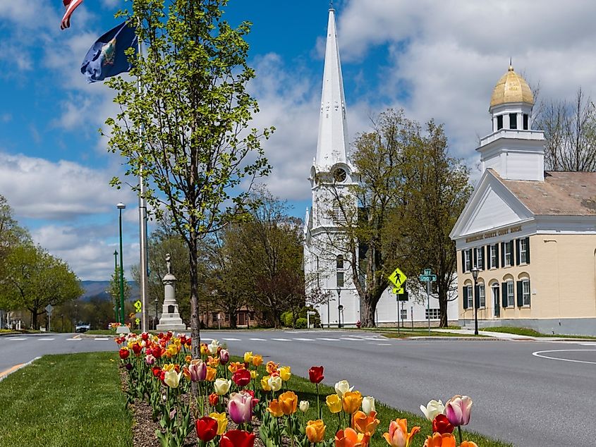 View of the historic and colorful Manchester Village in Manchester, Vermont with tulips in bloom.