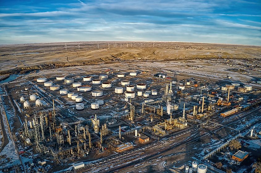 Aerial view of wind turbines lurking behind an oil refinery in Casper, Wyoming