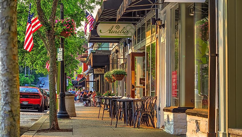 Summer Late Afternoon Warm Sunny Scene of Sidewalk and Shops on Main Street in the Business District of Historical Downtown Chagrin Falls, Ohio.