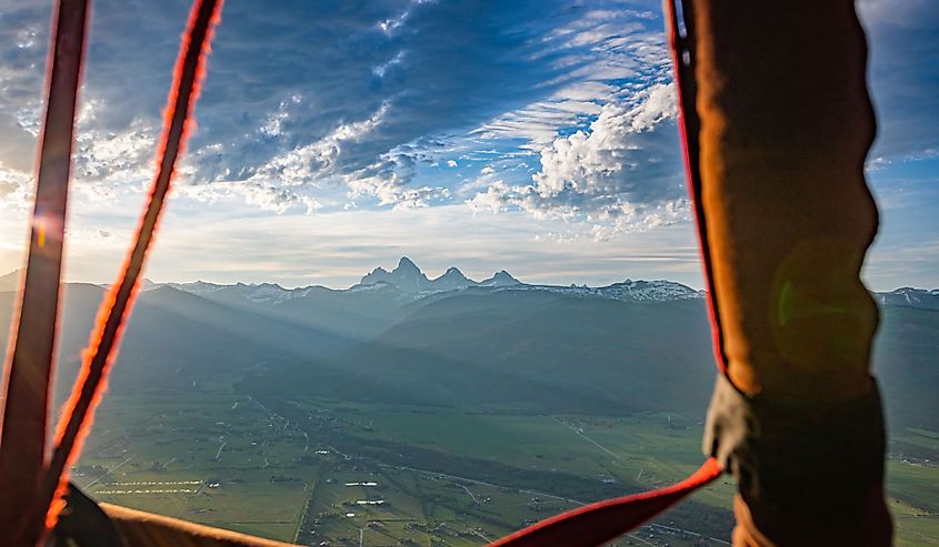 A hot air balloon view from Driggs, Idaho of the Grand Tetons in the Rocky Mountains of Wyoming.