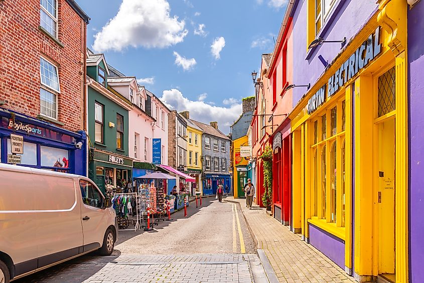 Narrow streets of brightly colored shops and cafes in the historic center of Kinsale, Ireland