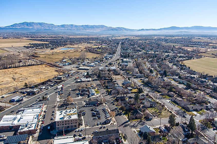 Aerial view of Minden and Gardnerville, Nevada, showcasing a diverse landscape with business, industry, residential, and agricultural areas along Highway 395 in the Carson Valley.