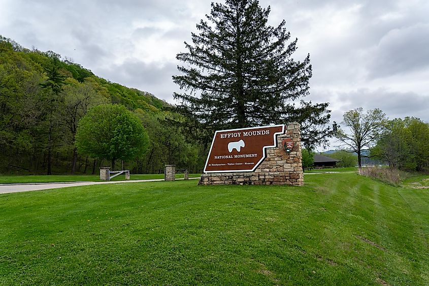 Harpers Ferry, Iowa - May 1, 2023: Effigy Mounds National Monument sign. Site preserves prehistoric mounds built by pre-Columbian Mound Builder cultures. Some effigy mounds are shaped like animals.