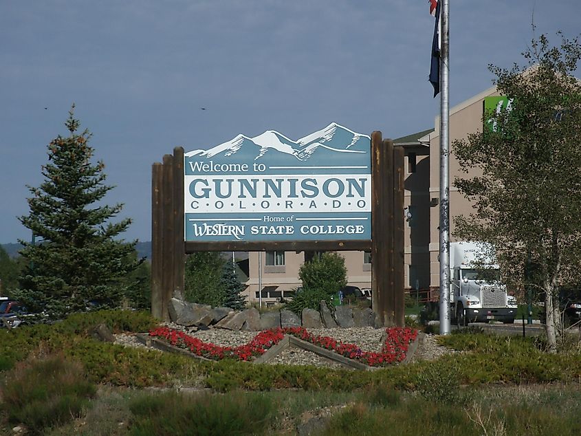 Welcome to Gunnison sign for travelers on Hwy 50 entering Gunnison from the east.