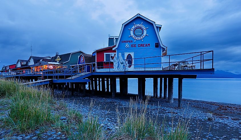 Small shop at Homer Spit Alaska before sunrise. Homer is a small city on Kachemak Bay, on Alaska’s Kenai Peninsula. Homer Spit is a long strip of land.