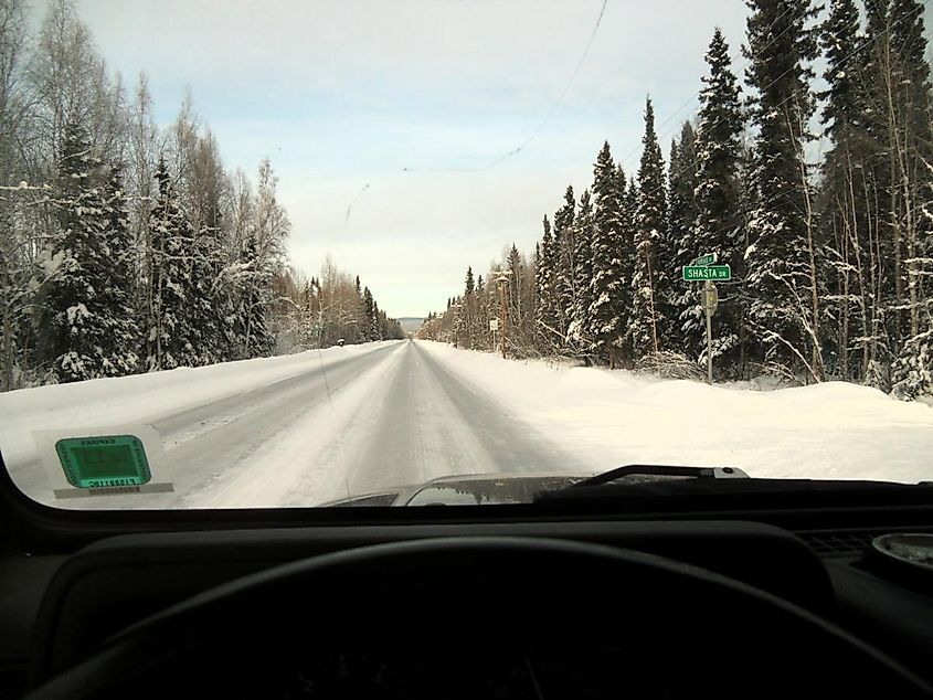 Driving a snowy Nordale Road near Badger, Alaska.
