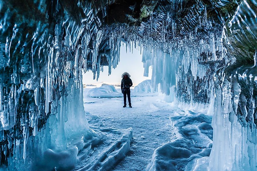 A man standing on the Frozen Baikal Lake in Irkutsk, Siberia