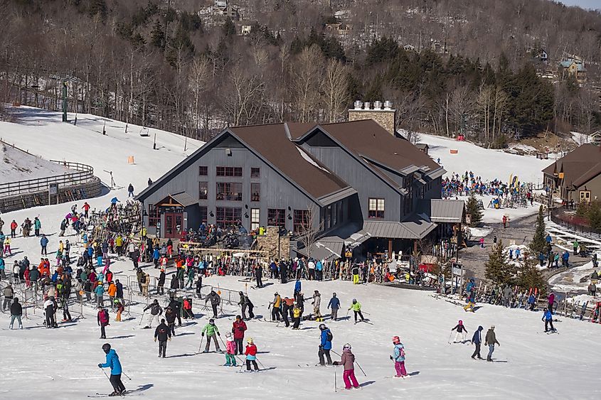 Crowd of skiers and lodge, Sugarbush Ski Area, via Rob Crandall / Shutterstock.com