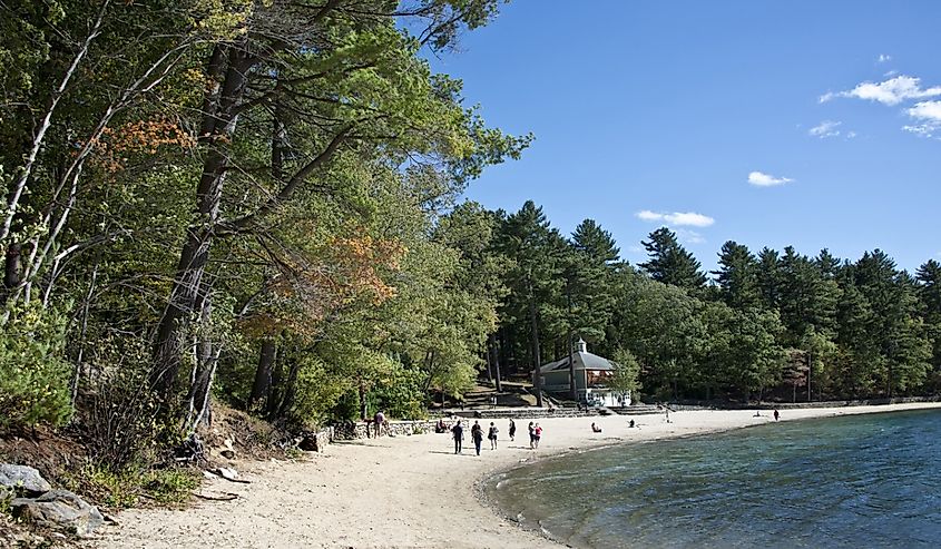 People on the sand beach at Walden Pond Massachusetts