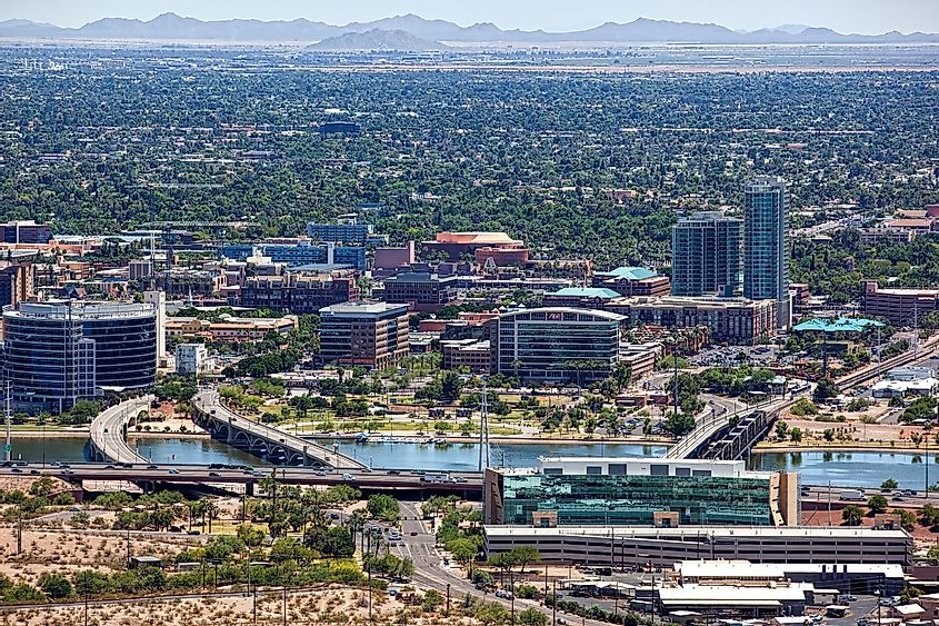 Clear day above Tempe, Arizona with the lake and downtown in the foreground and the San Tan Mountains on the distant horizon