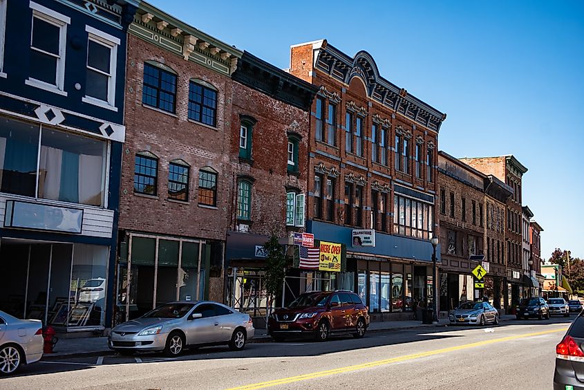 Front Street in Port Jervis, New York, lined with historic buildings and local businesses in a small-town setting