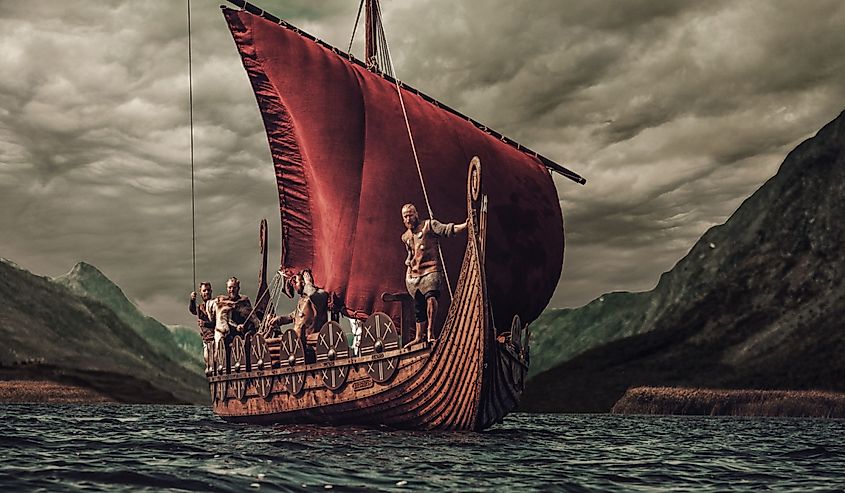 Group of vikings are floating on the sea.