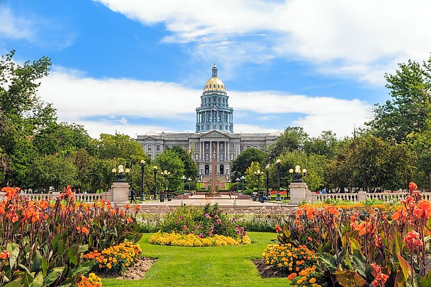 The Colorado State Capitol Building in Denver with flowers blooming.