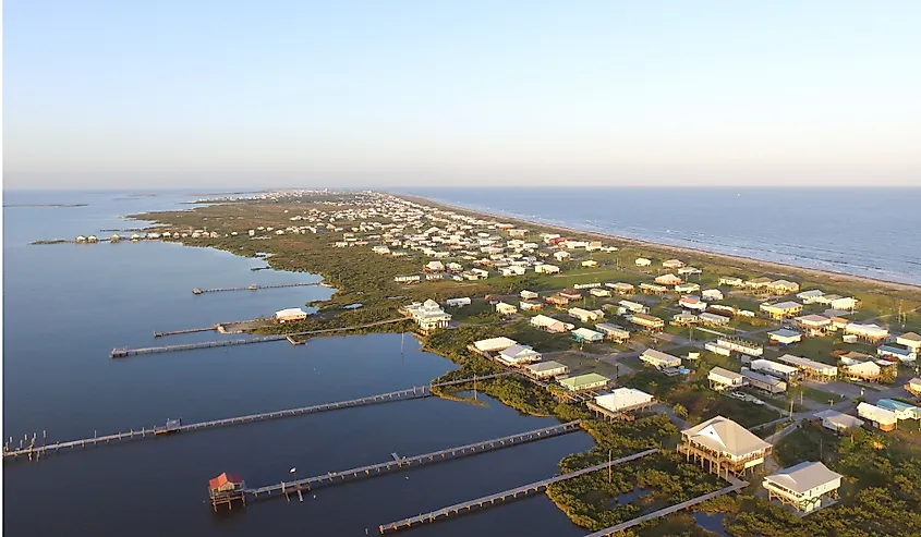 Stilt houses with long docks in the low-lying town of Grand Isle, Louisiana
