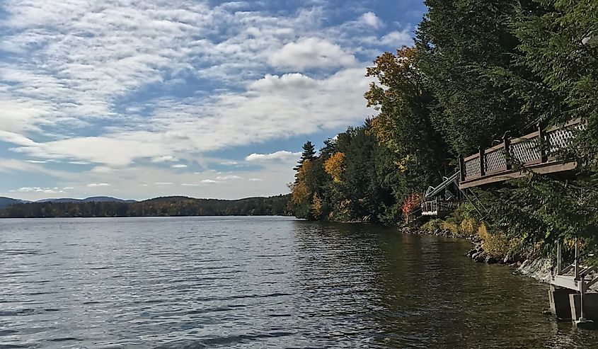 The fluffy clouds reflect on Lake Saint Catherine on a breezy fall day.