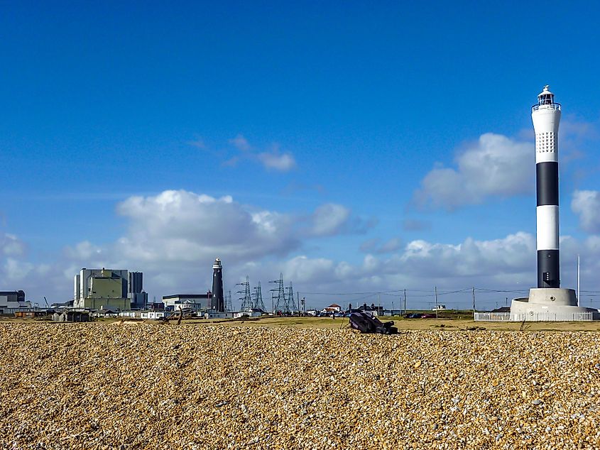 The Dungeness Lighthouse and a nuclear power plant in Dungeness, Kent, England