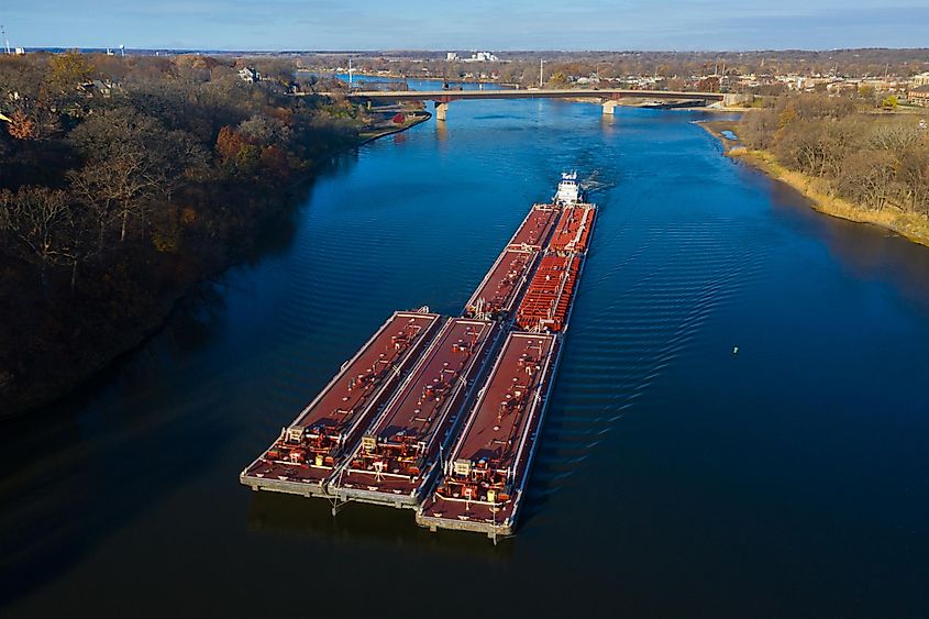 A red barge ships cargo down the Illinois River near Ottawa, Illinois. 