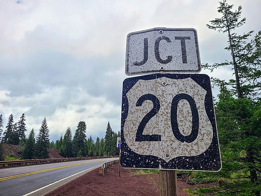 U.S. Route 20 Junction in Rural Forested Road.