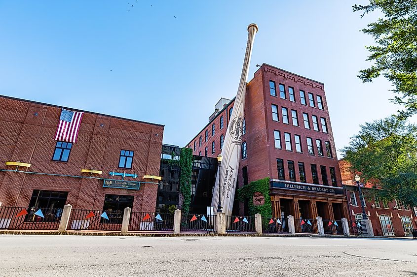 The Big Bat resting along the Louisville Slugger Museum building in Louisville, Kentucky.