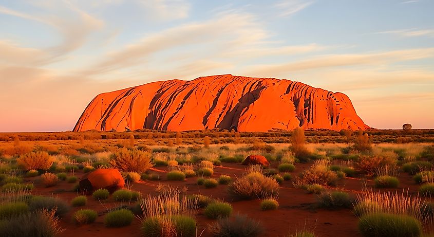 Breathtaking landscape photo of Uluru at sunrise. 