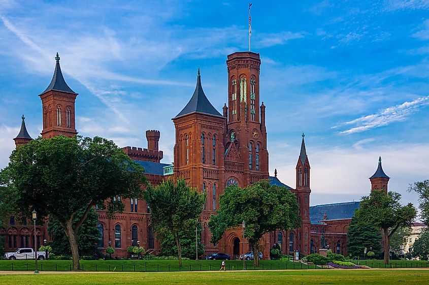 side angle view of red brick castle like headquarters of the Smithsonian Institute on national mall