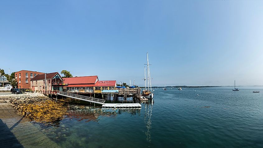 Beautiful houses in Victorian style and boats at the pier in Castine