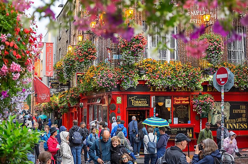 People walking by famous Irish pub , THE TEMPLE BAR