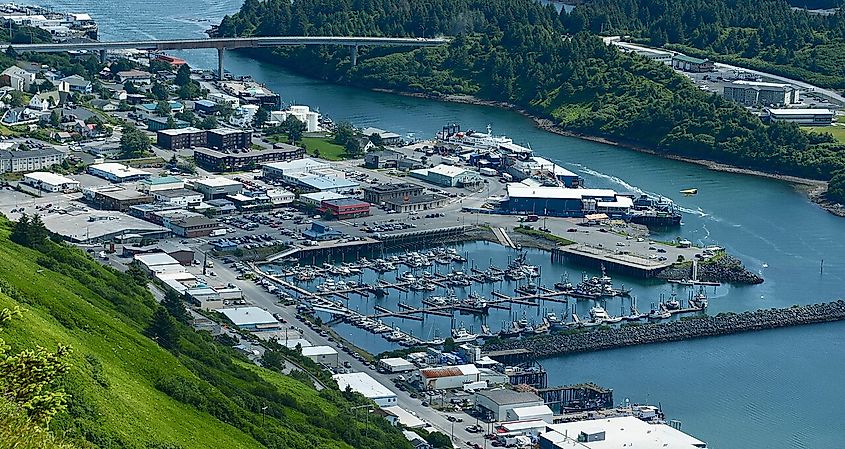 Aerial view of downtown Kodiak with city buildings, water, and greenery.