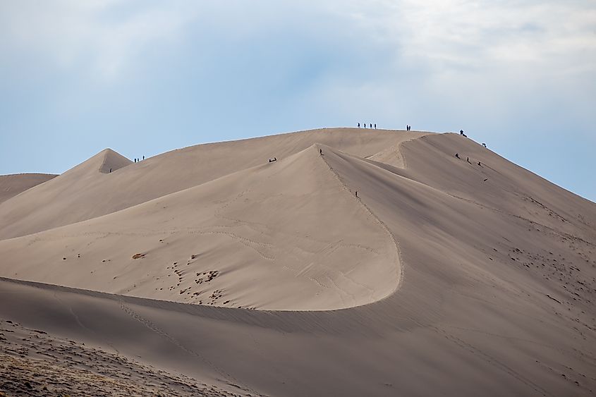 Hikers at Bruneau Sand Dunes State Park, near Boise, Idaho.