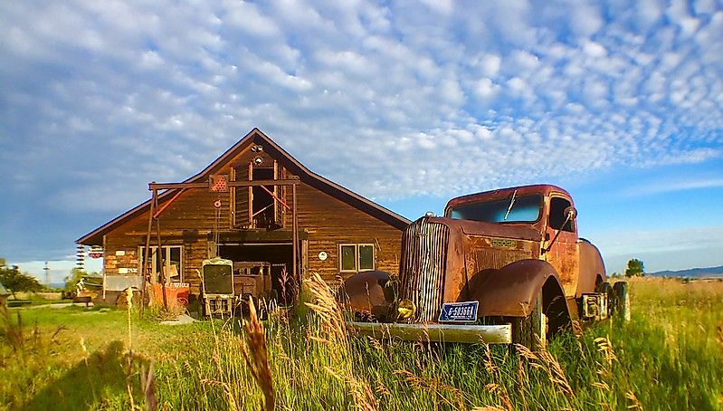 Old car in a field in Belgrade, Montana