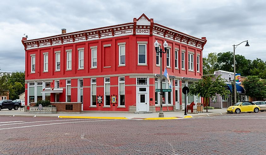 The original Farmers State Bank building in Lindsborg, Kansas, is now home to City Hall and sports a bright red coat of paint.