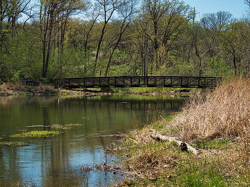 Metal footbridge over Lake Lenexa at Black Hoof Park in Lenexa, Kansas