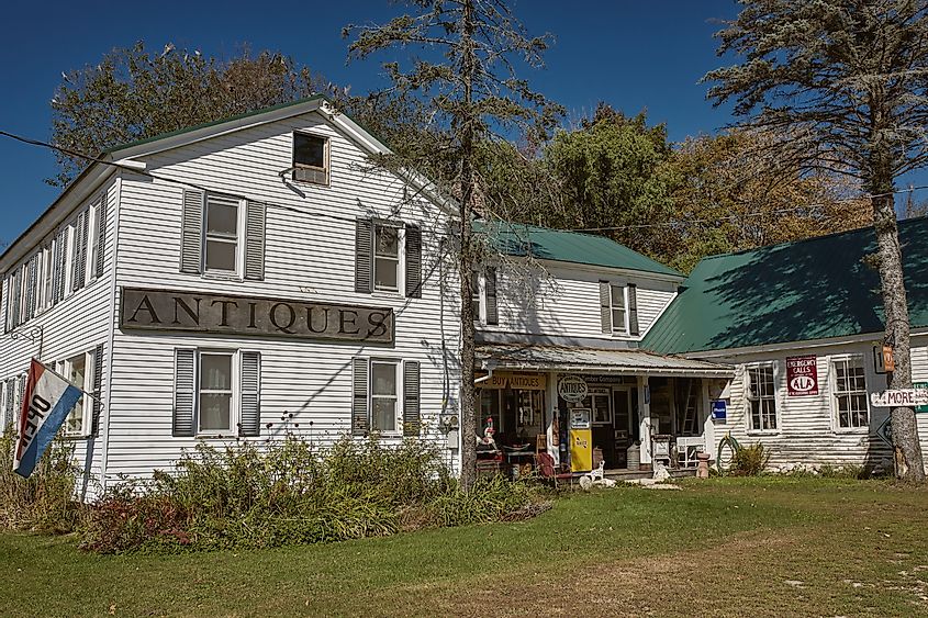 Exterior of Steam Mill Antiques historic farmhouse in Bethel, Maine, nestled in the White Mountains.