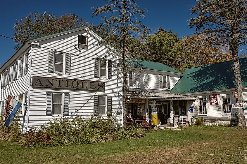 Exterior of Steam Mill Antiques historic farmhouse in Bethel, Maine, nestled in the White Mountains