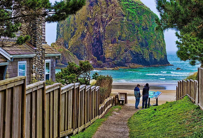 Public beach access path at Cannon Beach, Oregon, with the coastline and Haystack Rock.