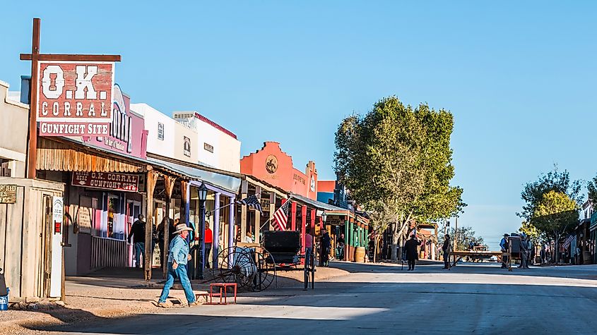 Looking down Allen Street in historic Tombstone, Arizona, with cowboys and tourists.
