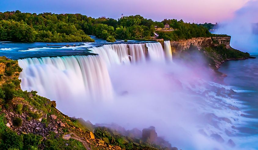 Niagara falls in the summer during beautiful evening, night with clear dark sunset blue sky