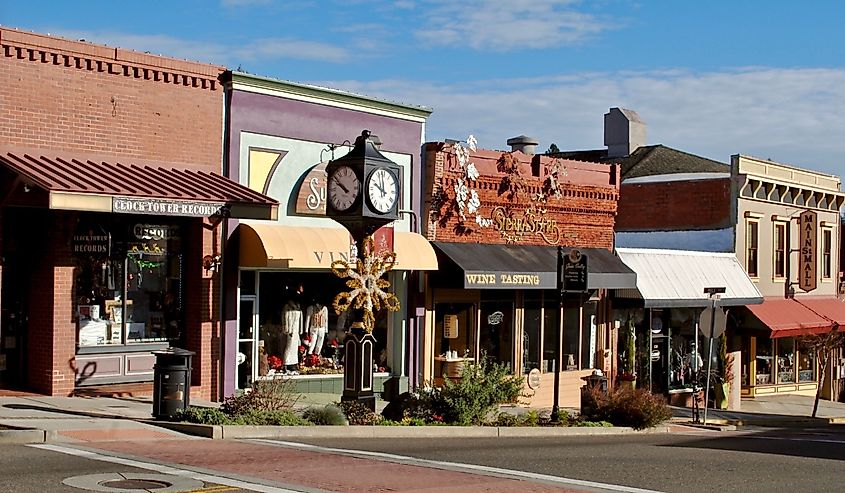 Main Street with a clock tower, Clock Tower Records, Sierra Star Winery, and Pete's Pizza, Grass Valley, California