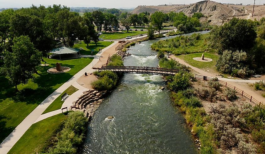 River and walking bridge in Public Park in Montrose, Colorado